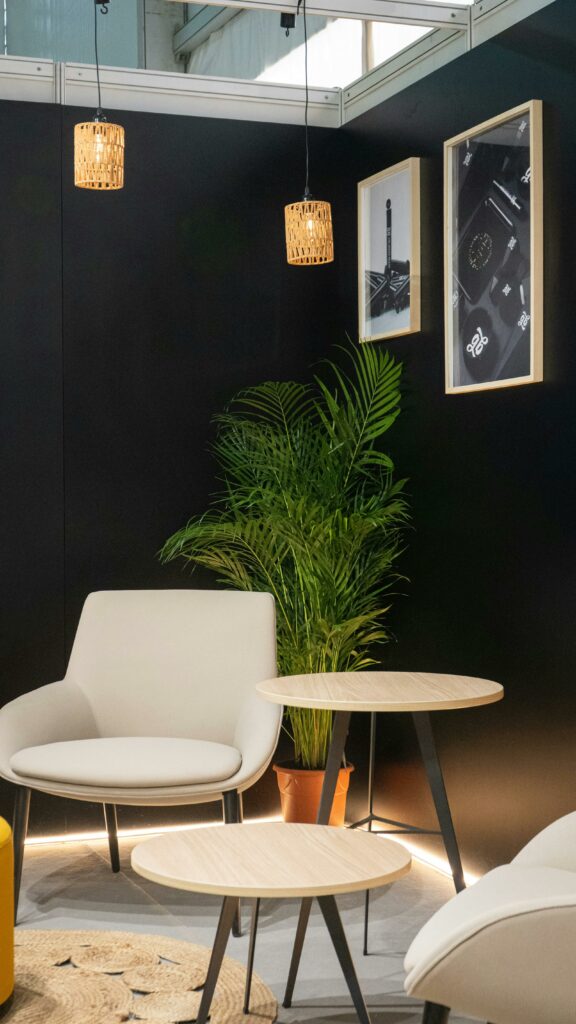 A stylish exhibition booth showcasing modern Scandinavian furniture and decor elements.